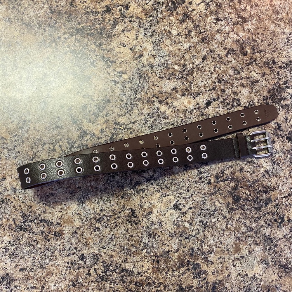 Brown leather belt with metal holes